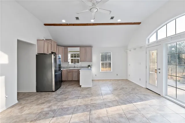 a view of a kitchen with a sink and a window
