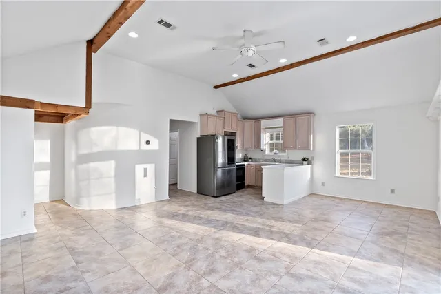 a kitchen that has a sink and a stove in it