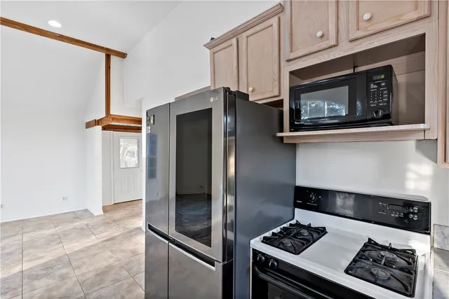 a bathroom with a tub shower sink and vanity