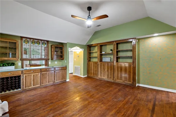 a living room with furniture and a kitchen