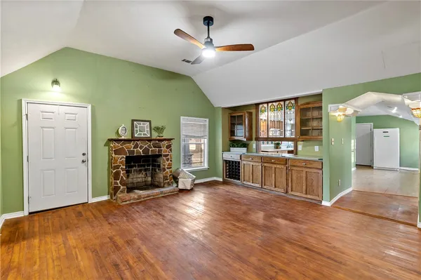 a view of a door with a chairs and table in a room