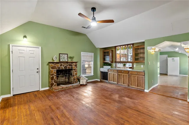 a view of a door with a chairs and table in a room
