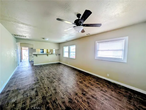 a furnished livingroom with a window