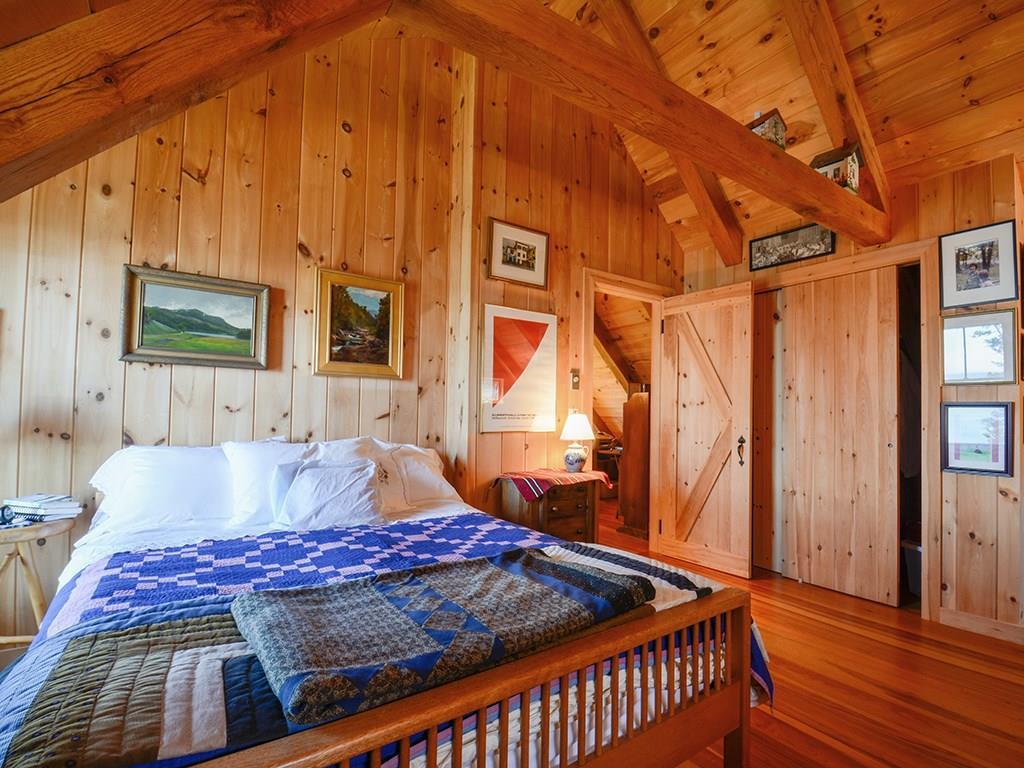 555 Jericho Bay Road Swans Island, ME 04685 - Photo 24 of 35 Bedroom with vaulted ceiling and...