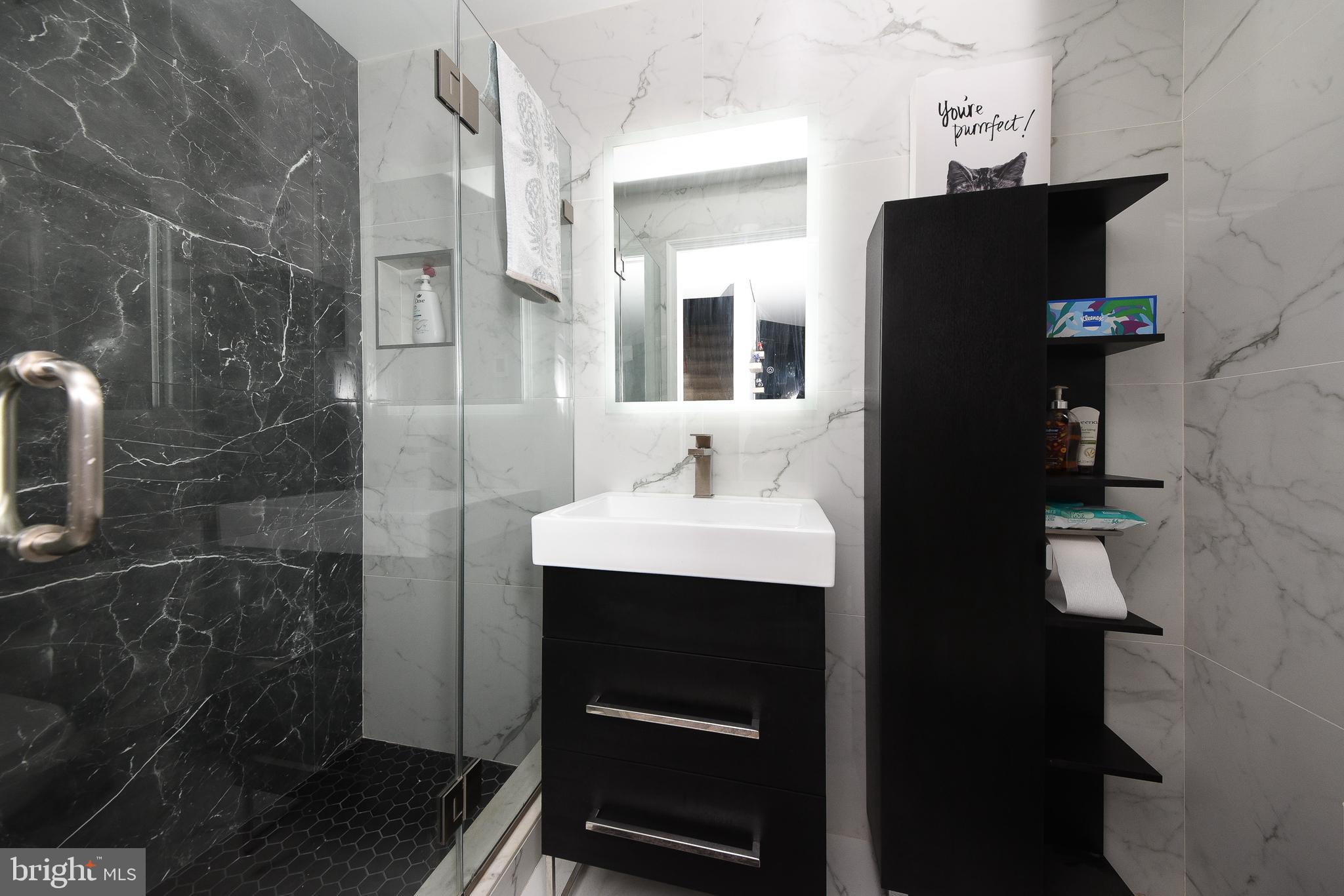 1014 North York Road Willow Grove, PA 19090 - Photo 14 of 33 a bathroom with a sink and mirror