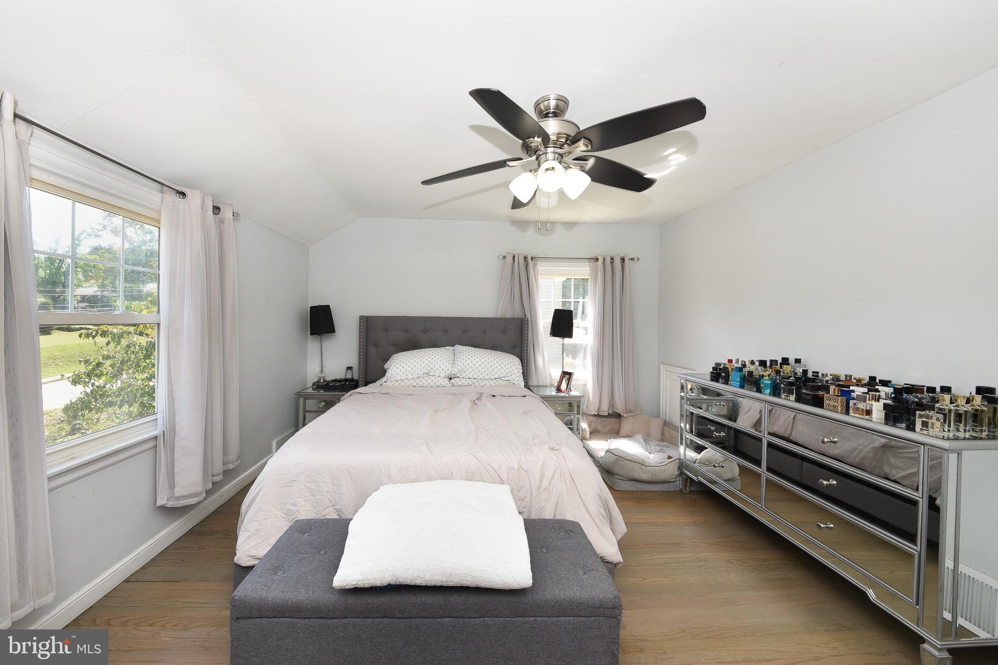 1014 North York Road Willow Grove, PA 19090 - Photo 17 of 33 a bedroom with a bed and a chandelier