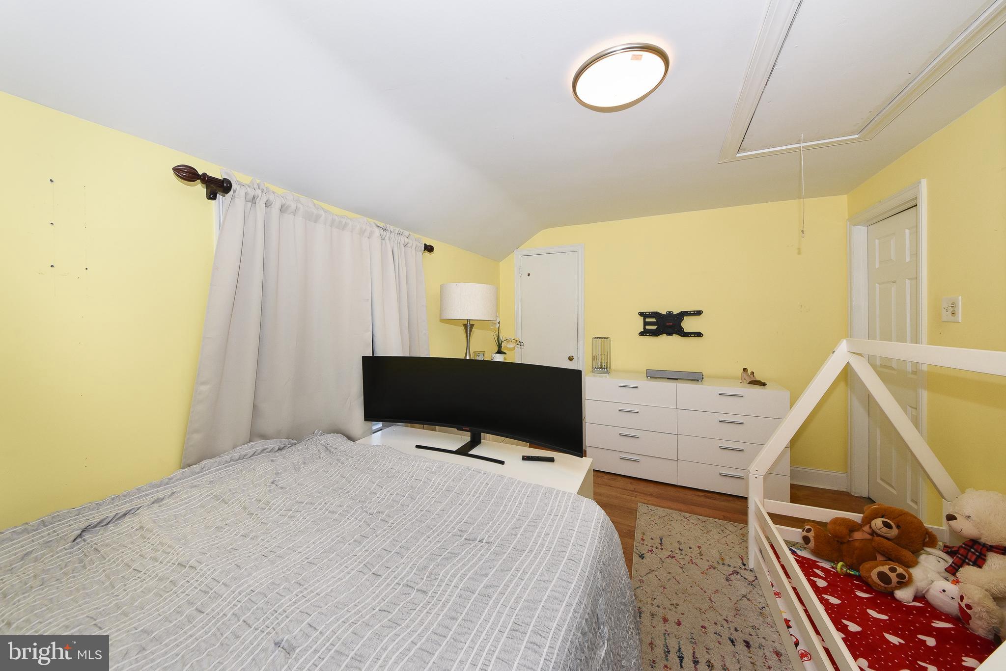 1014 North York Road Willow Grove, PA 19090 - Photo 20 of 33 a bed room with a bed window and a mirror