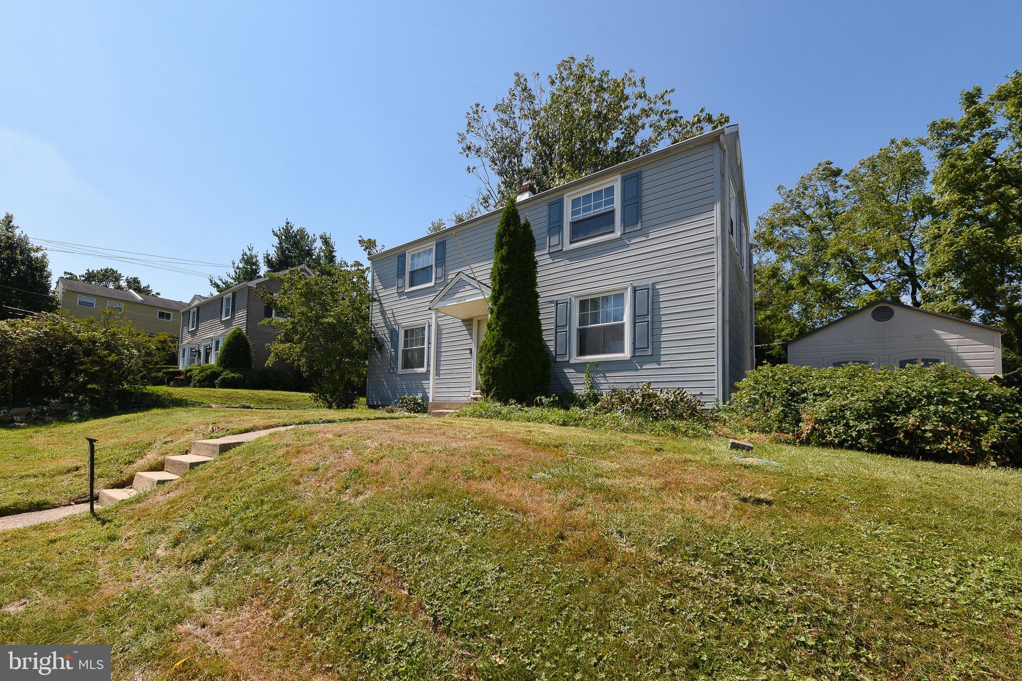 1014 North York Road Willow Grove, PA 19090 - Photo 3 of 33 a yellow house with trees in front of it