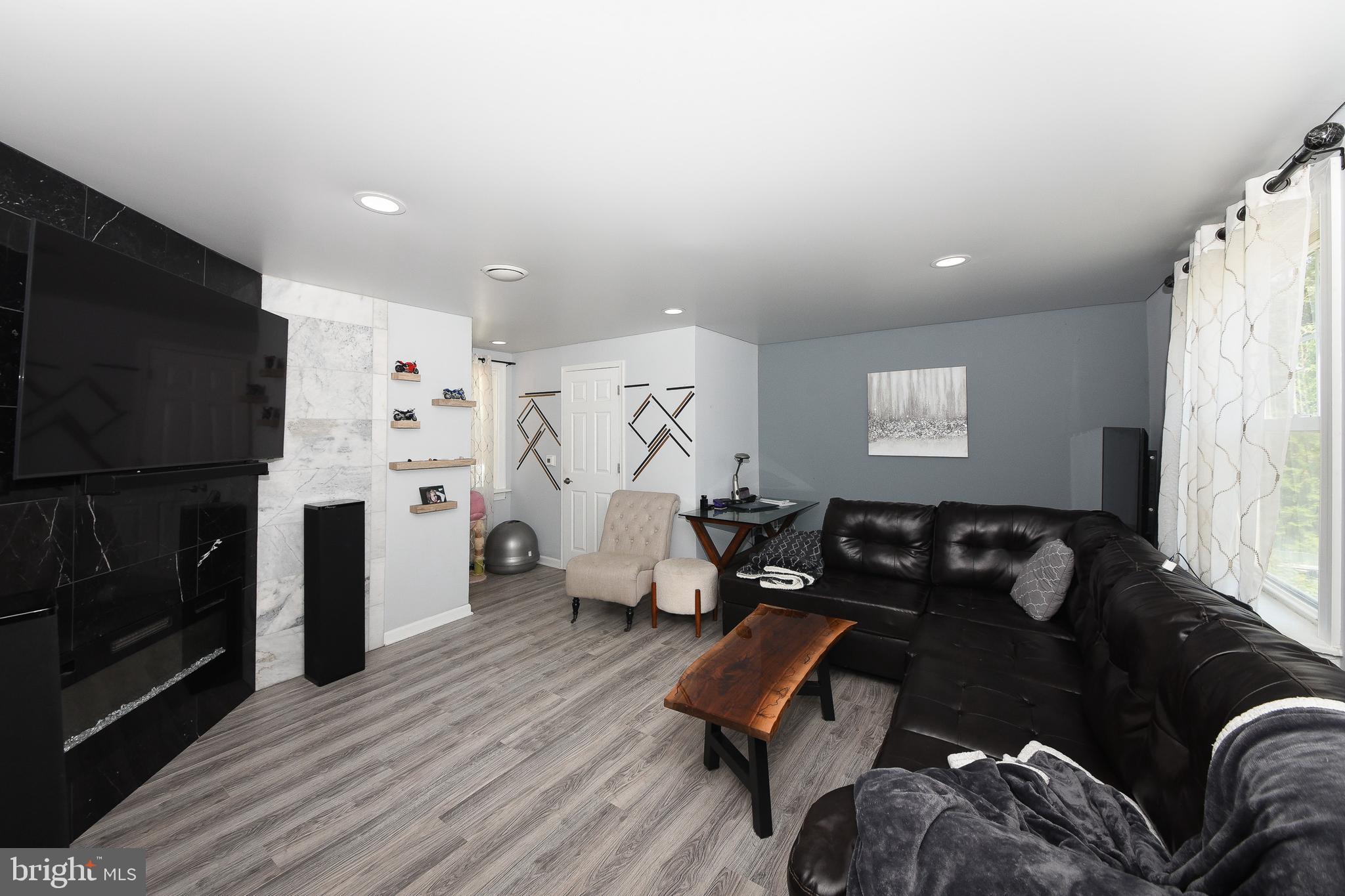 1014 North York Road Willow Grove, PA 19090 - Photo 4 of 33 a living room with furniture and a flat screen tv
