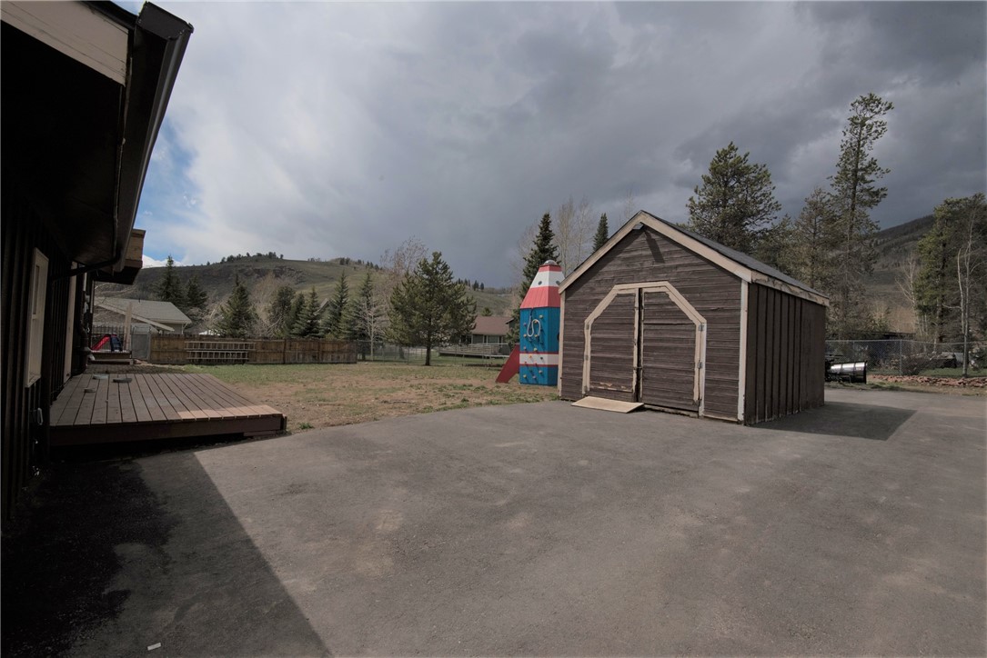 423 Big Elk Road Dillon, CO 80435 - Photo 32 of 35 Lots of asphalt for parking! Drive through shed, for real.