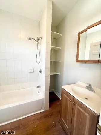a bathroom with a bathtub and a sink