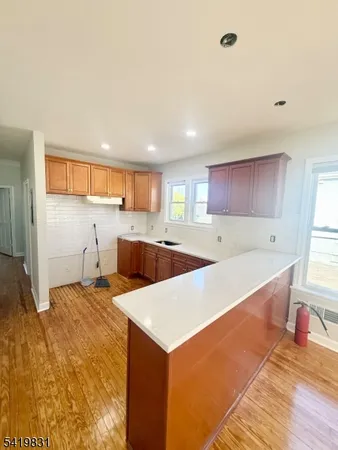a view of kitchen with center island and living room