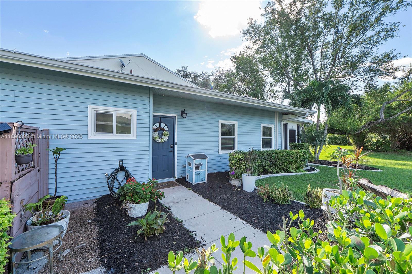 4764 South Hemingway Circle Margate, FL 33063 - Photo 1 of 30 a front view of a house with garden