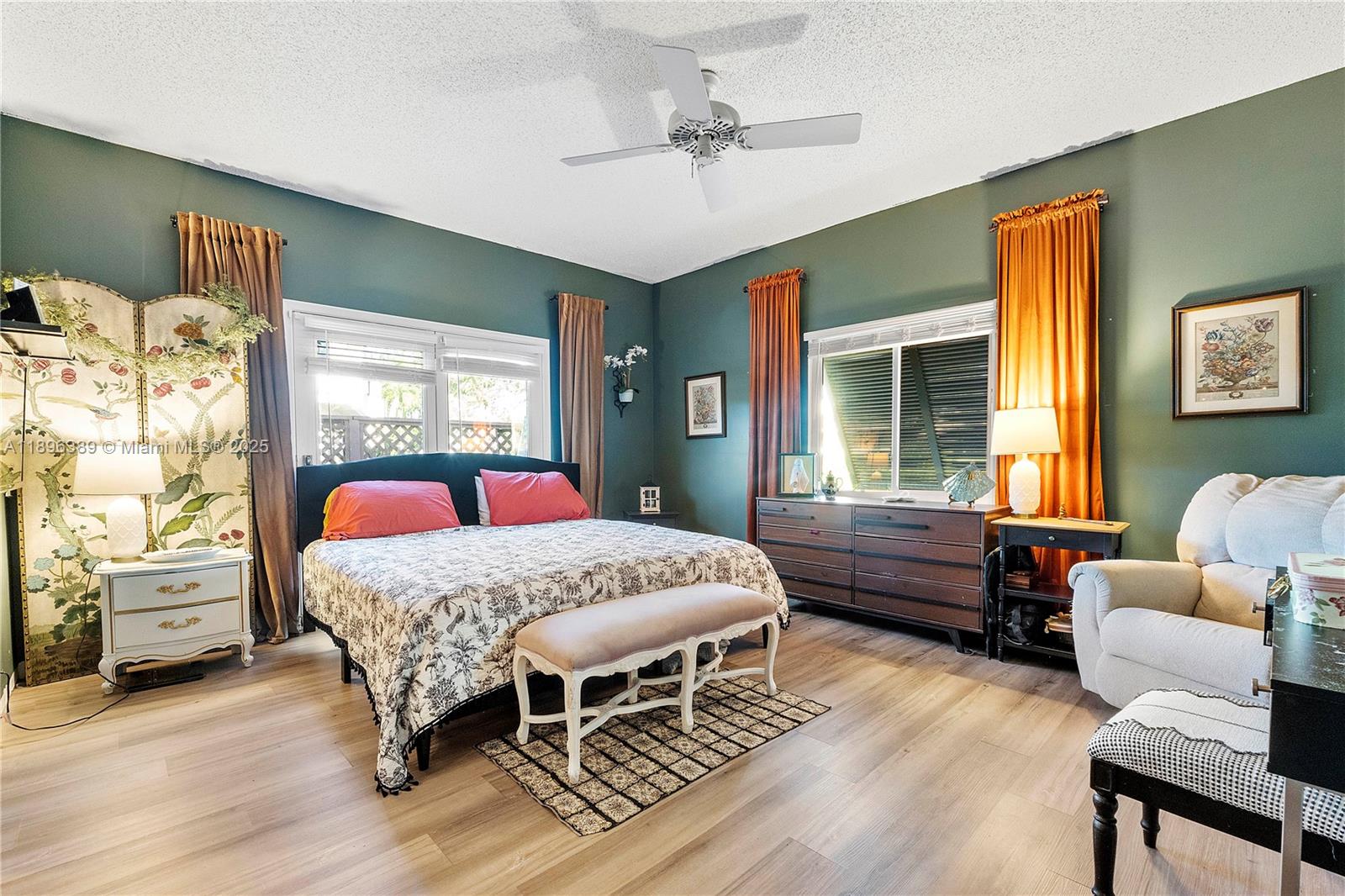 4764 South Hemingway Circle Margate, FL 33063 - Photo 12 of 30 a bedroom with a bed and wooden floor