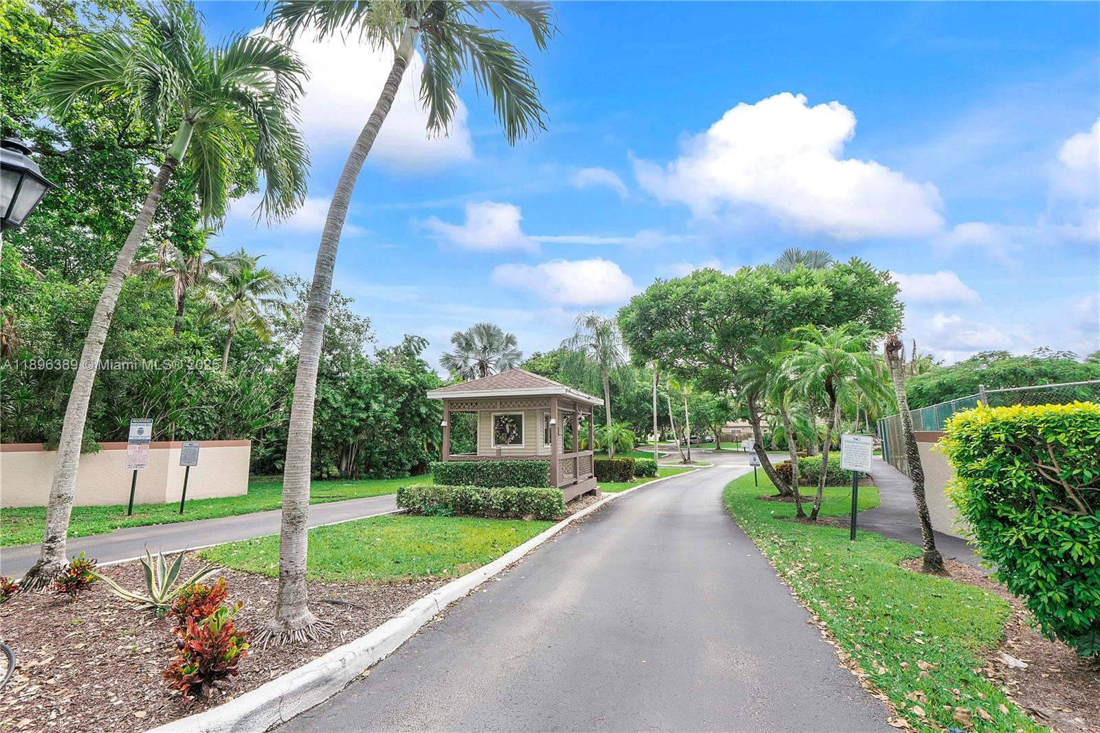 4764 South Hemingway Circle Margate, FL 33063 - Photo 20 of 30 a view of an house with backyard space and garden