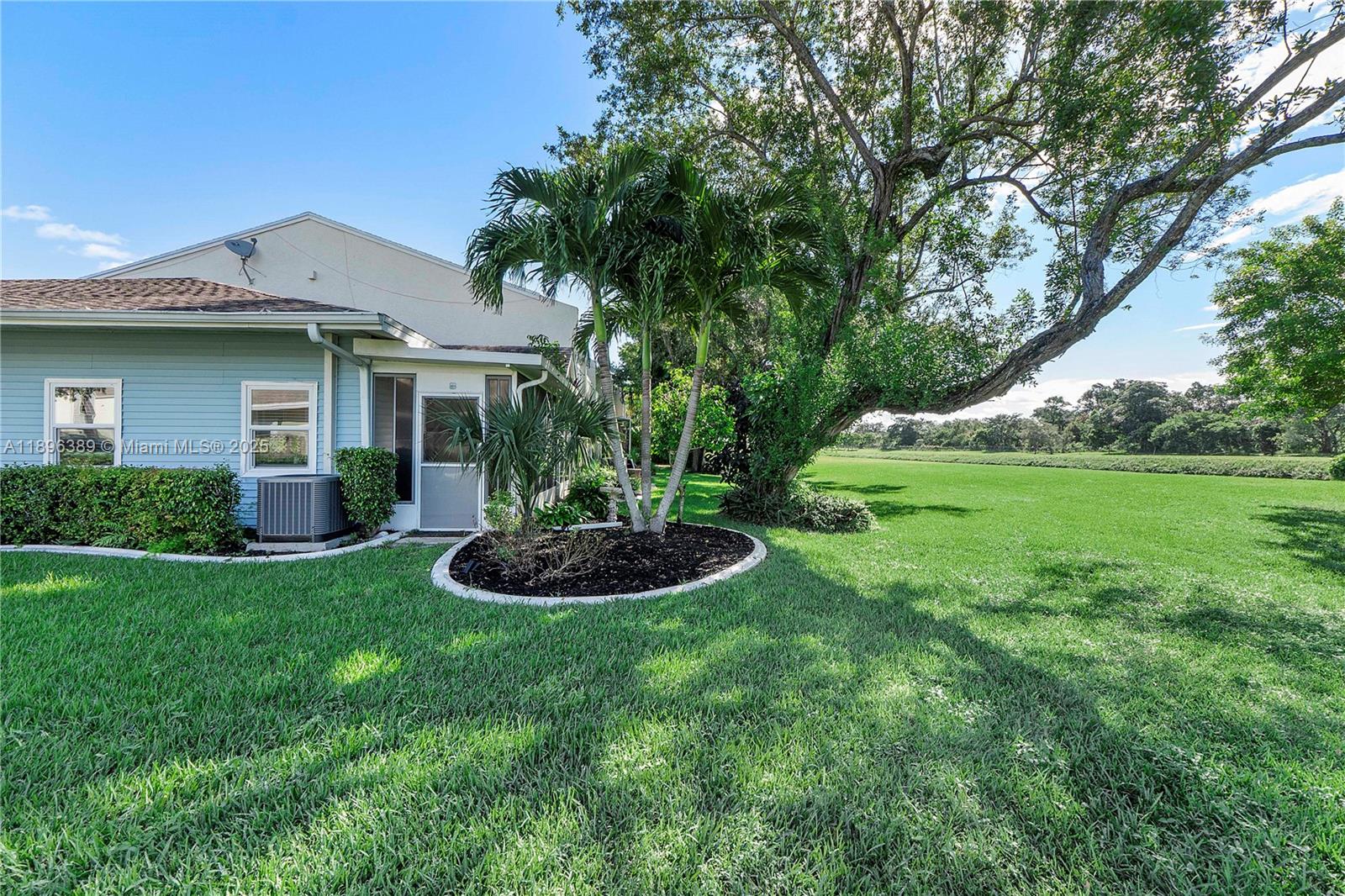4764 South Hemingway Circle Margate, FL 33063 - Photo 2 of 30 a view of a house with a backyard and a garden