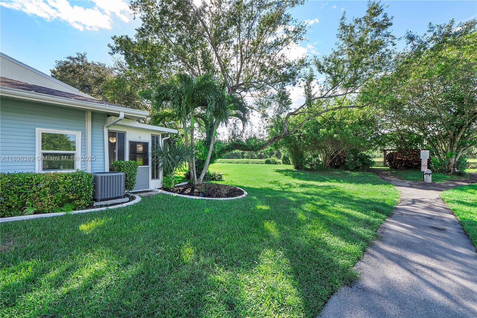 4764 South Hemingway Circle Margate, FL 33063 - Photo 23 of 30 a view of a house with a yard and a large tree