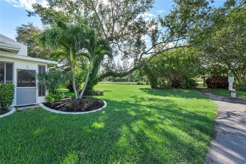 a view of a garden with a fountain