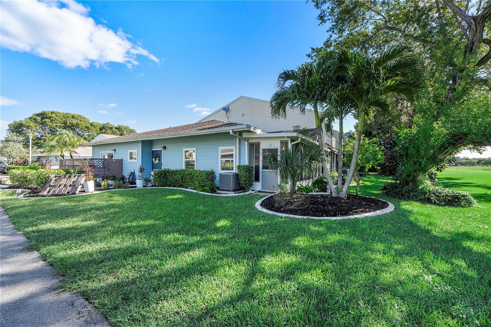 4764 South Hemingway Circle Margate, FL 33063 - Photo 25 of 30 a front view of a house with a yard