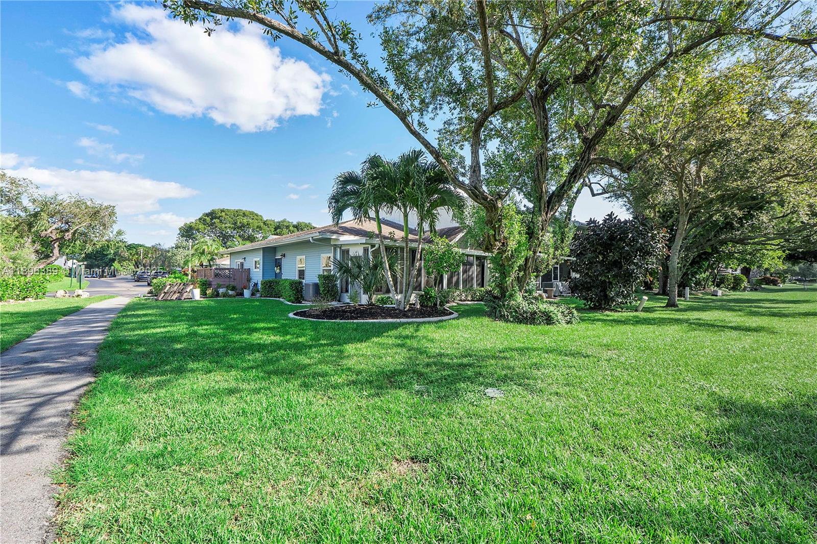 4764 South Hemingway Circle Margate, FL 33063 - Photo 26 of 30 a view of yard with swimming pool and green space