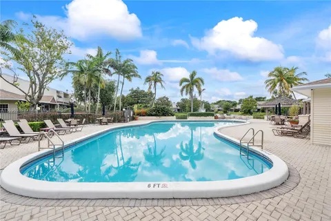 a view of swimming pool with outdoor seating