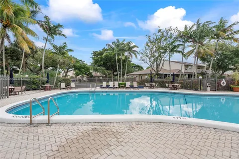a view of a swimming pool with a lounge chairs