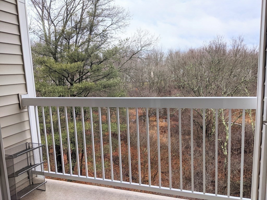 70 Trotter Road, Unit 312 Weymouth, MA 02190 - Photo 11 of 18 a view of a wooden fence