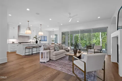 a kitchen with cabinets and chandelier