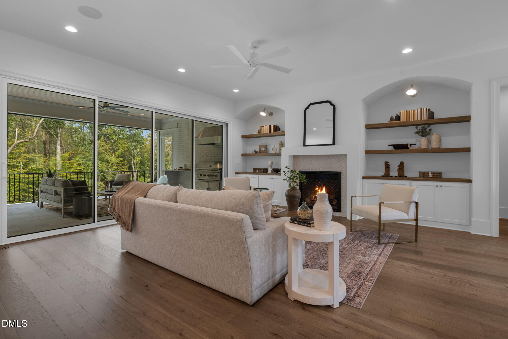 1609 Legacy Ridge Lane Wake Forest, NC 27587 - Photo 13 of 71 a living room with furniture a large window and a fireplace