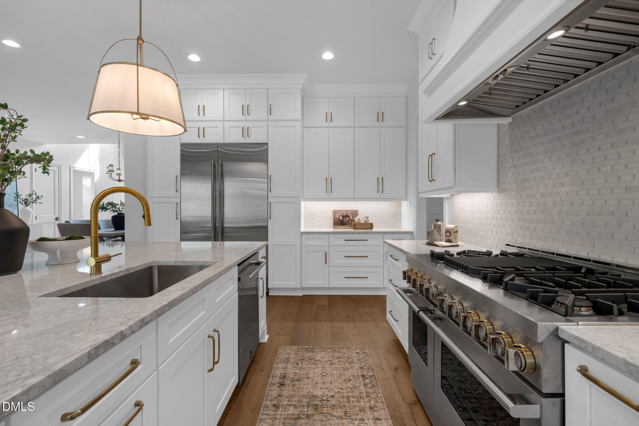 1609 Legacy Ridge Lane Wake Forest, NC 27587 - Photo 19 of 71 a kitchen with granite countertop a sink stove and cabinets