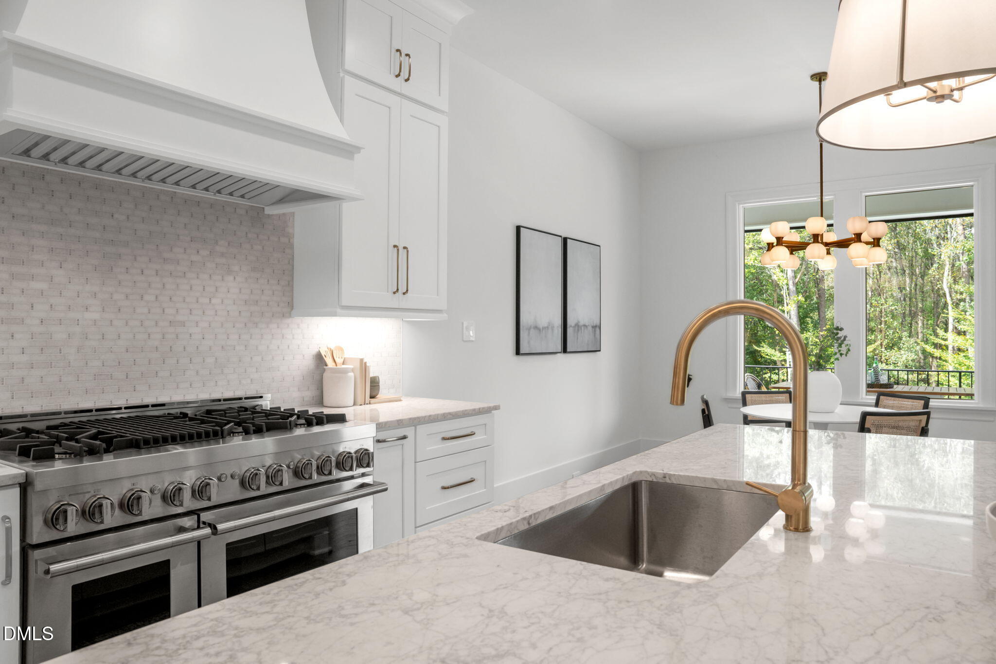 1609 Legacy Ridge Lane Wake Forest, NC 27587 - Photo 20 of 71 a kitchen with granite countertop a stove and a sink