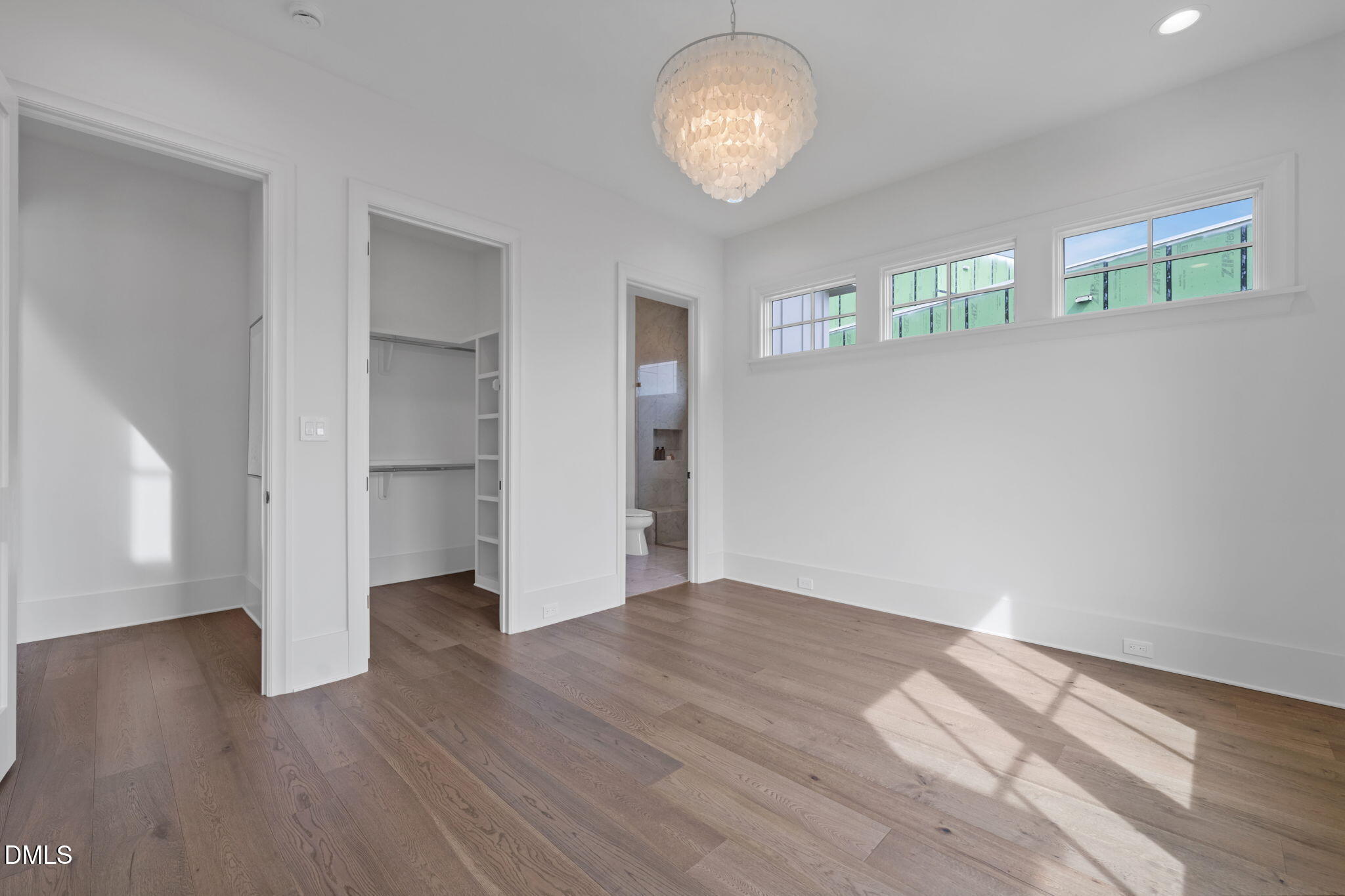 1609 Legacy Ridge Lane Wake Forest, NC 27587 - Photo 43 of 71 an empty room with wooden floor and windows