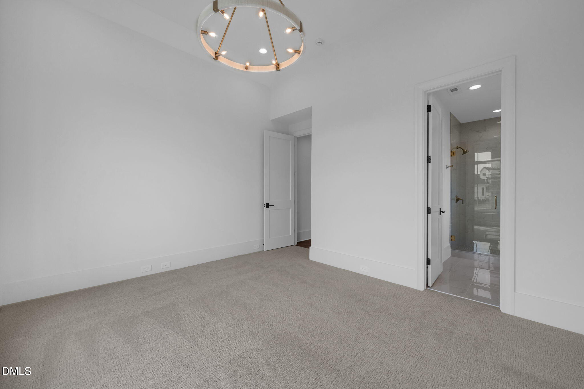 1609 Legacy Ridge Lane Wake Forest, NC 27587 - Photo 49 of 71 en empty room with chandelier fan