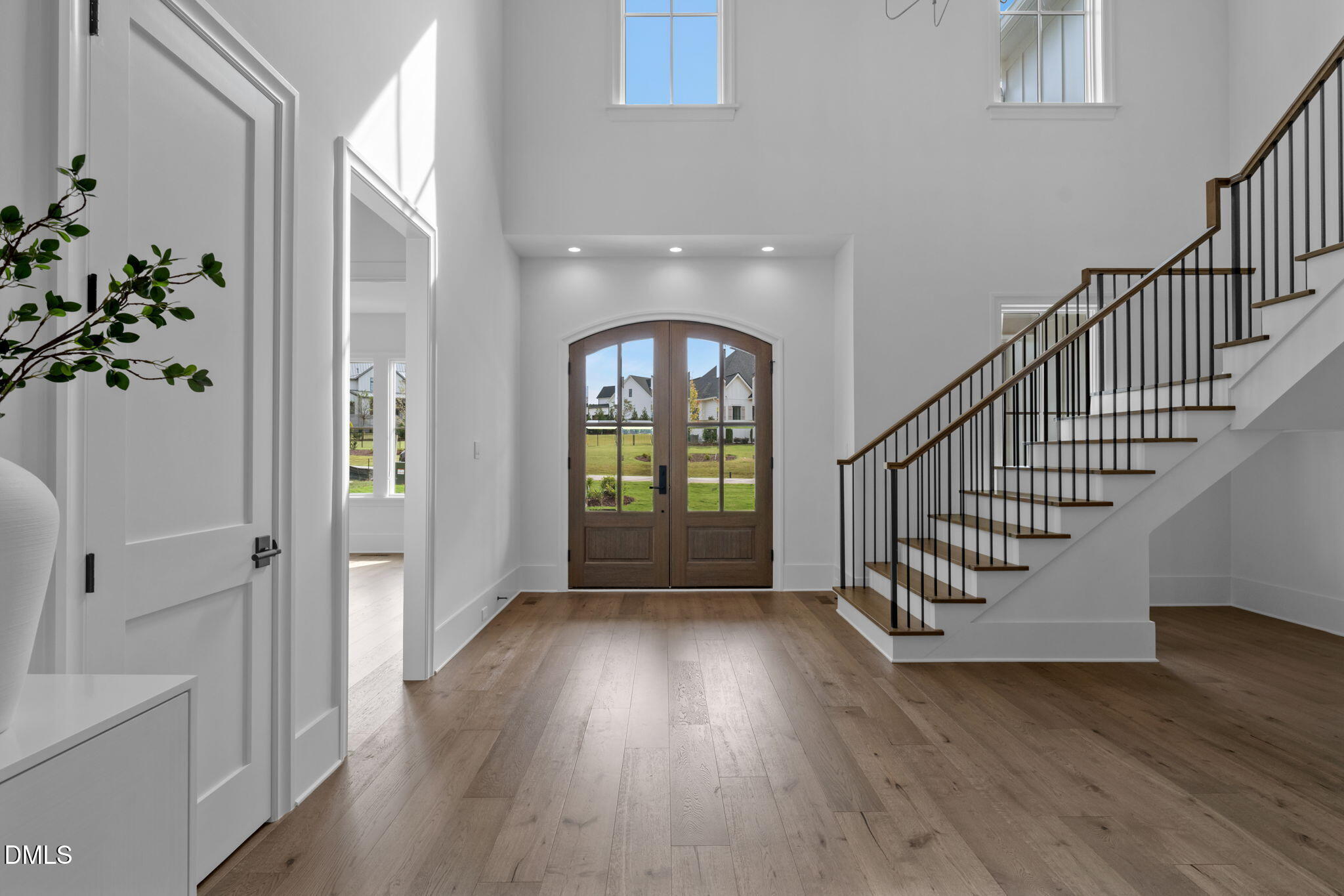 1609 Legacy Ridge Lane Wake Forest, NC 27587 - Photo 6 of 71 a view of a hallway with wooden floor and entryway