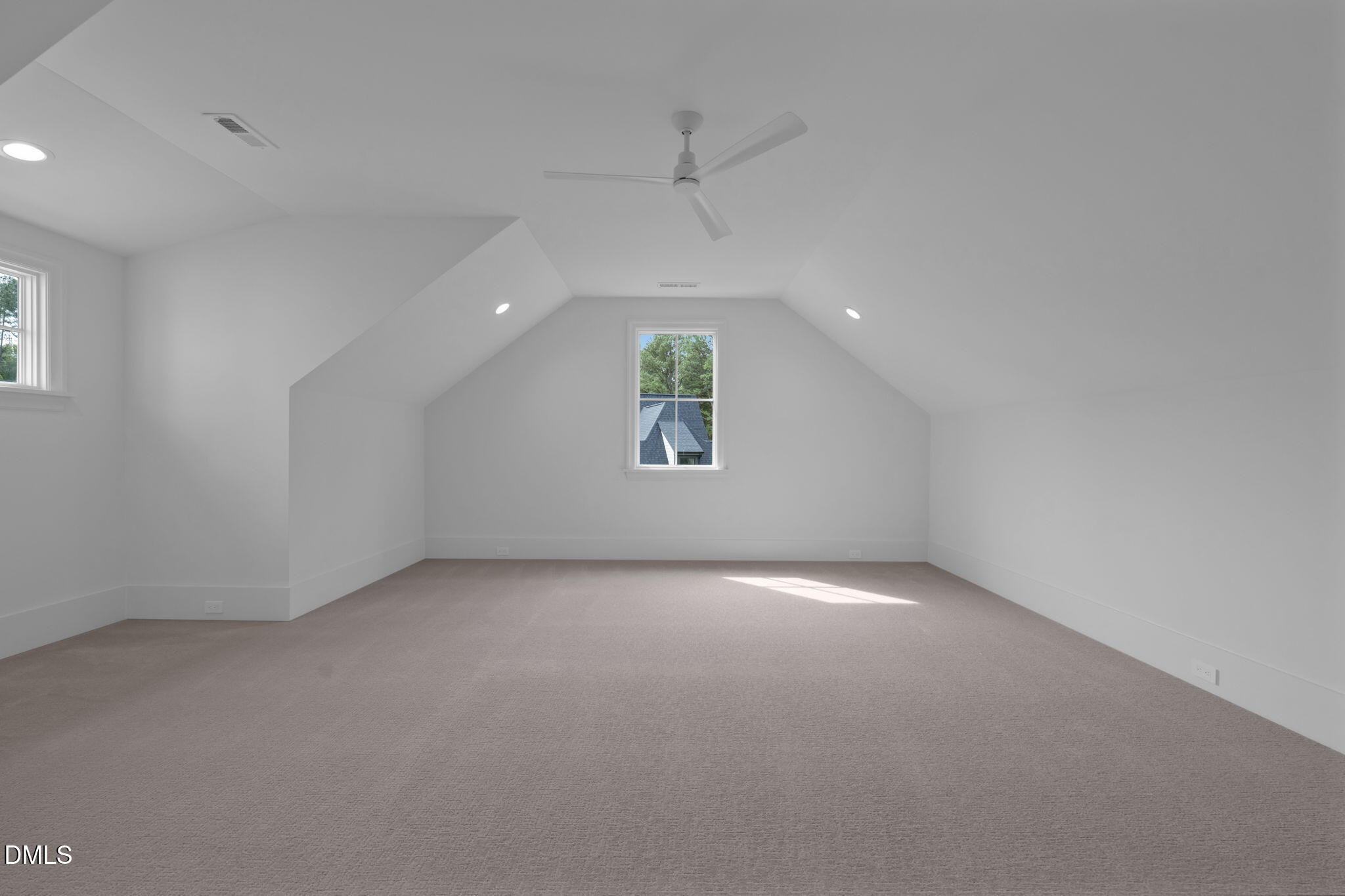 1609 Legacy Ridge Lane Wake Forest, NC 27587 - Photo 61 of 71 an empty room with windows and a ceiling fan