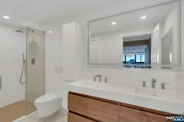 a bathroom with a toilet sink and tub
