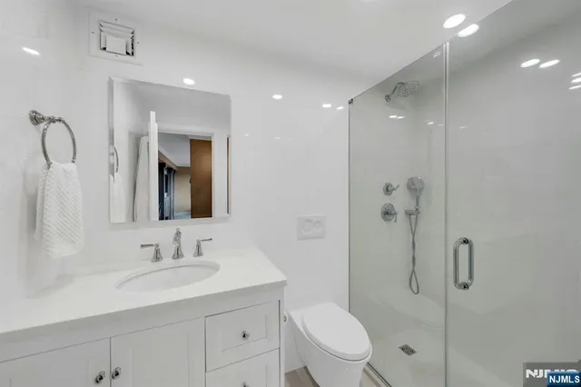 an aerial view of residential building and trees around