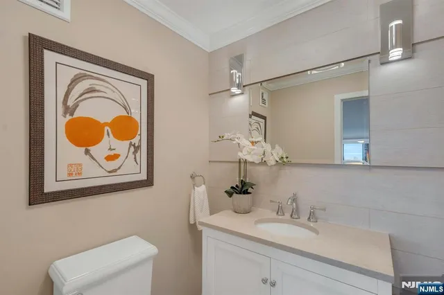 a living room with furniture window and a flat screen tv