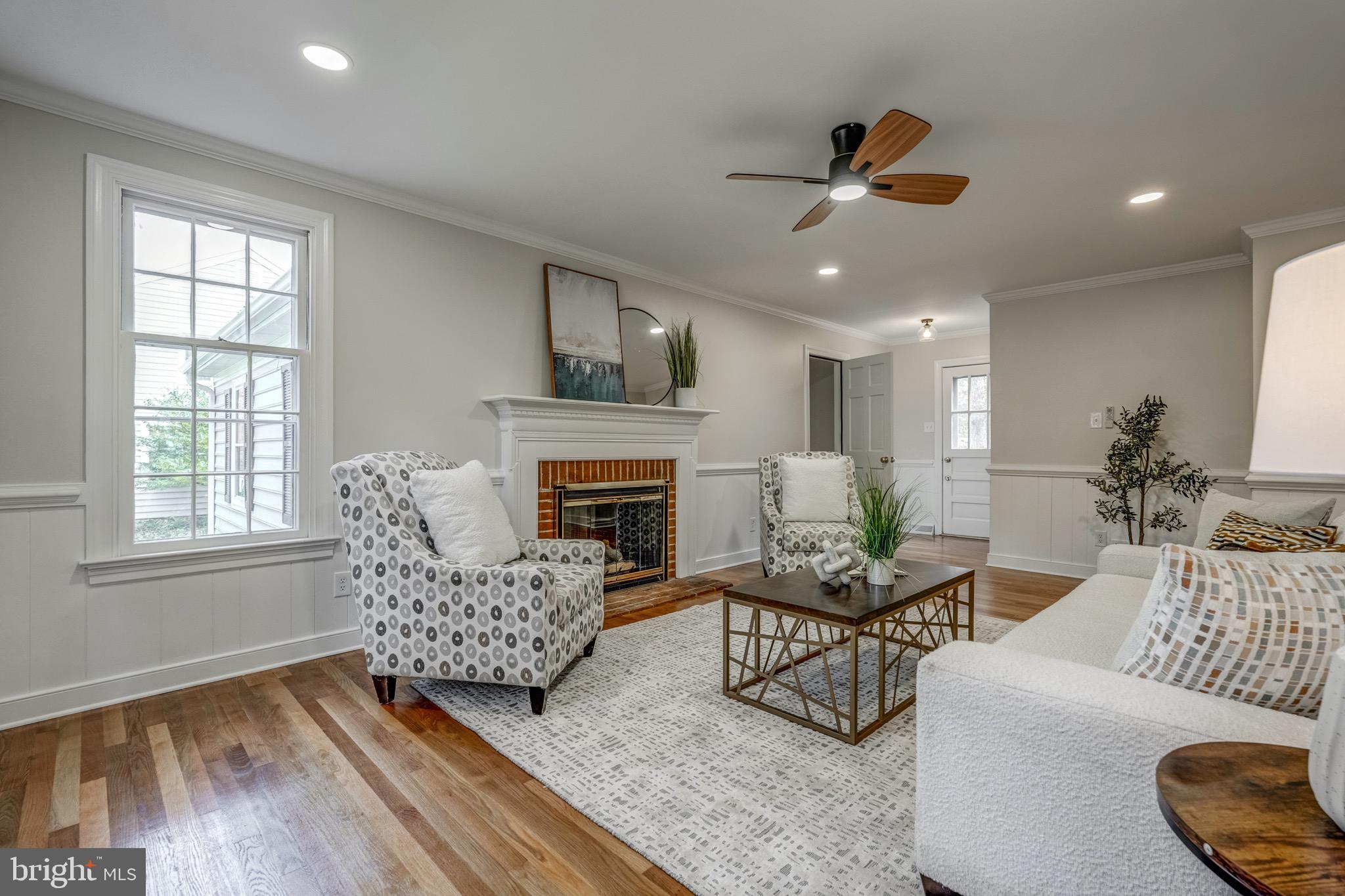 1771 Robindale Road North Chesterfield, VA 23235 - Photo 11 of 67 a living room with furniture and a fireplace