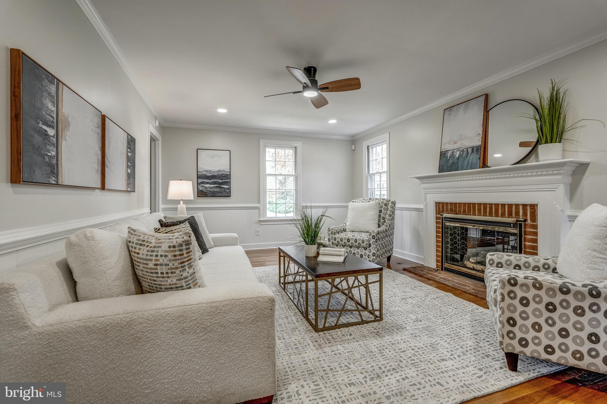 1771 Robindale Road North Chesterfield, VA 23235 - Photo 13 of 67 a living room with furniture and a fireplace