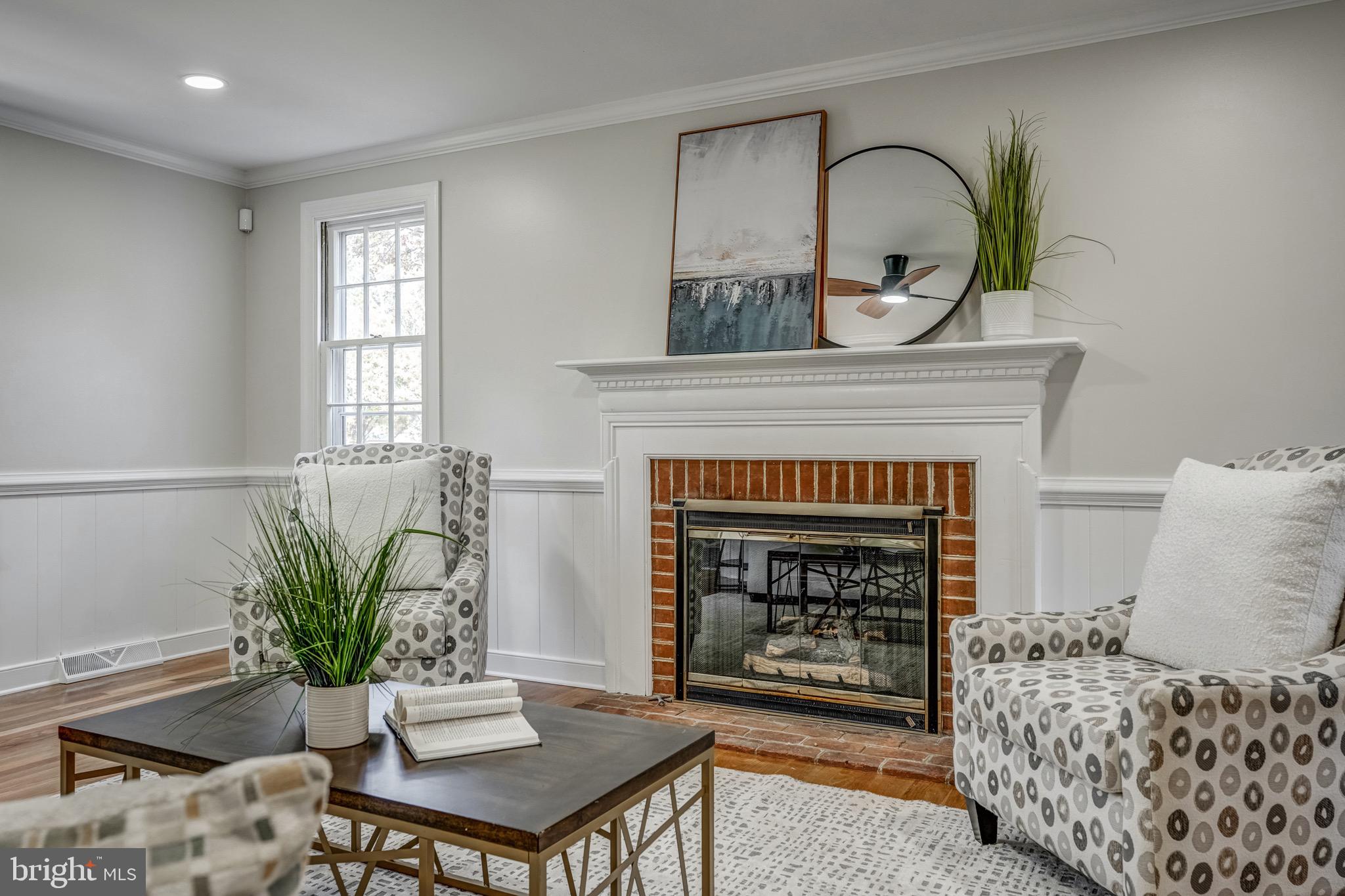 1771 Robindale Road North Chesterfield, VA 23235 - Photo 15 of 67 a living room with furniture and a fireplace