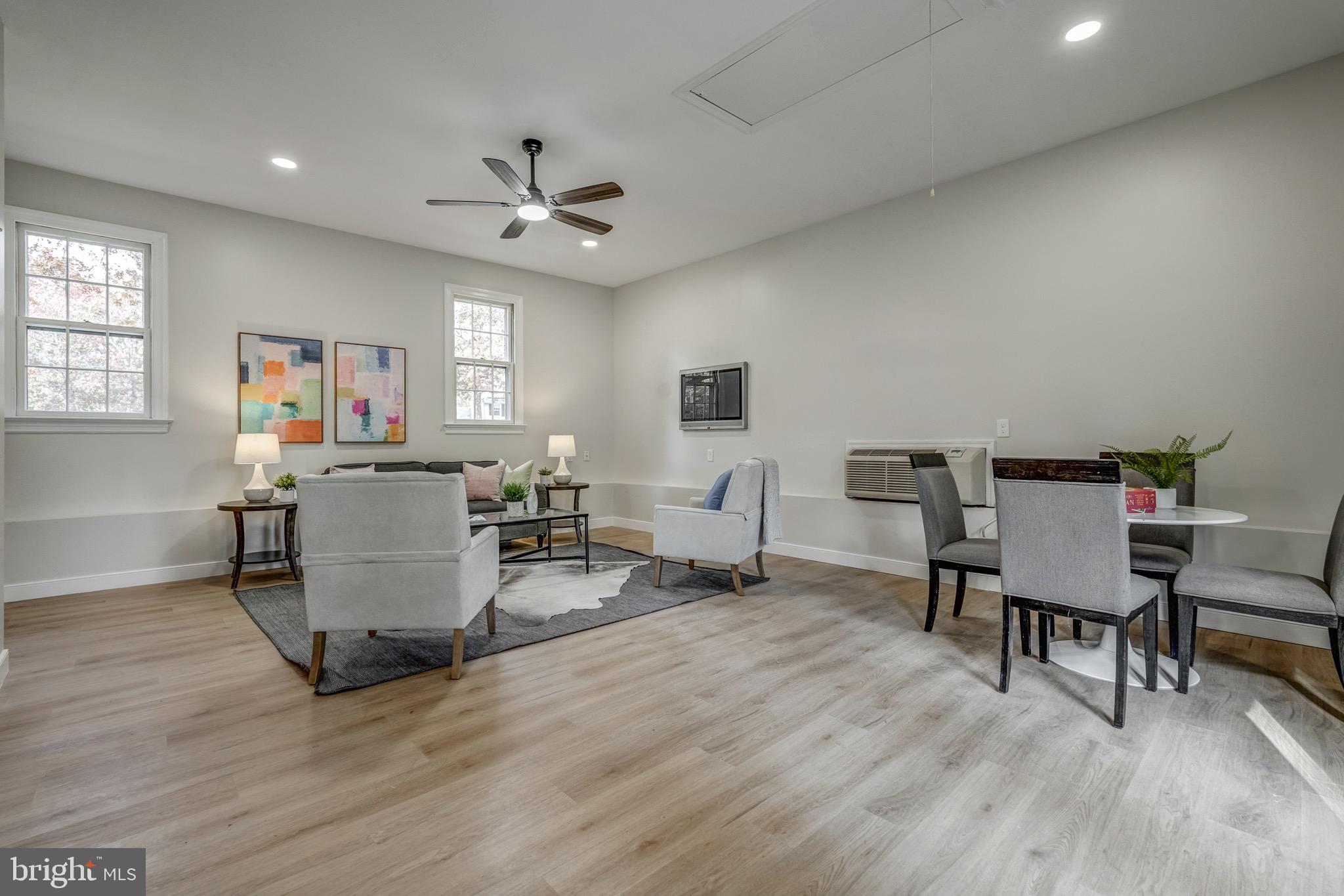 1771 Robindale Road North Chesterfield, VA 23235 - Photo 19 of 67 a living room with furniture a window and wooden floor