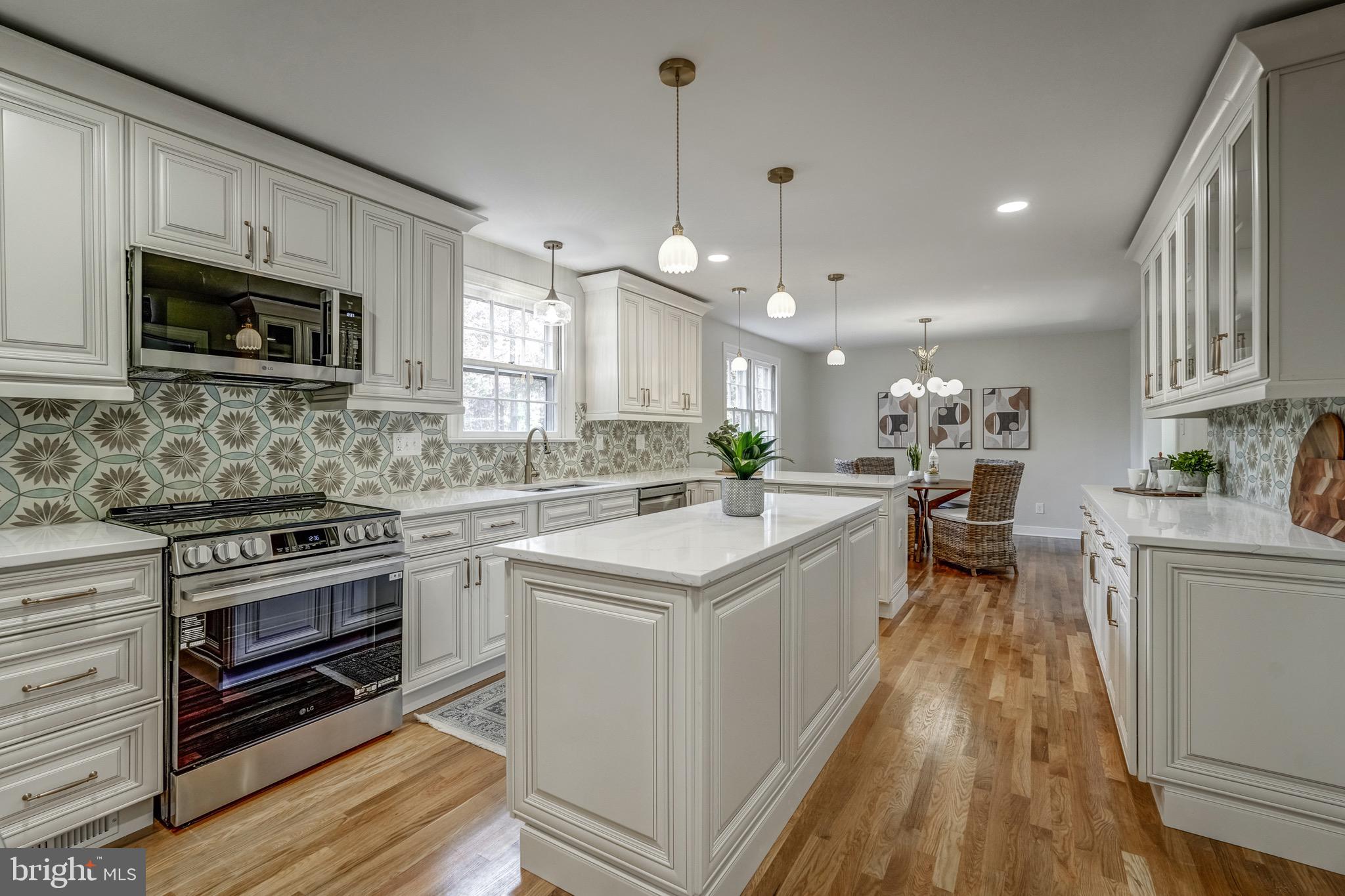 1771 Robindale Road North Chesterfield, VA 23235 - Photo 23 of 67 a kitchen with a stove sink microwave and cabinets