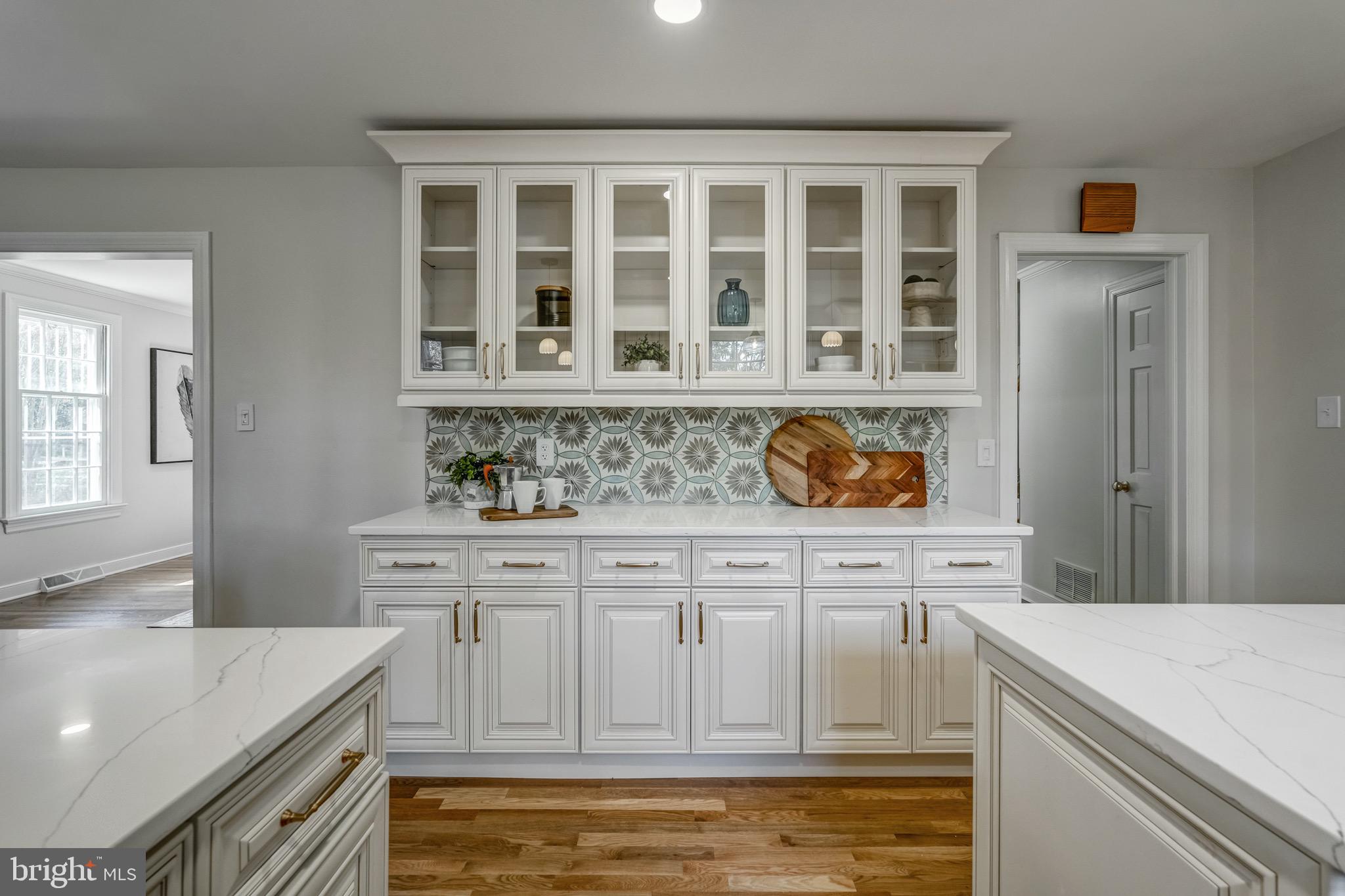 1771 Robindale Road North Chesterfield, VA 23235 - Photo 27 of 67 a kitchen with granite countertop white cabinets and sink