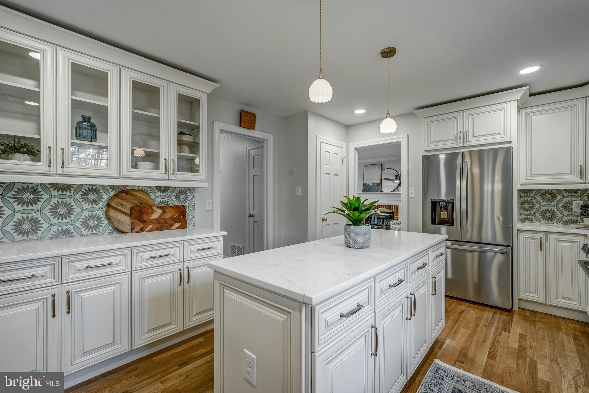1771 Robindale Road North Chesterfield, VA 23235 - Photo 28 of 67 a kitchen with white cabinets and center island
