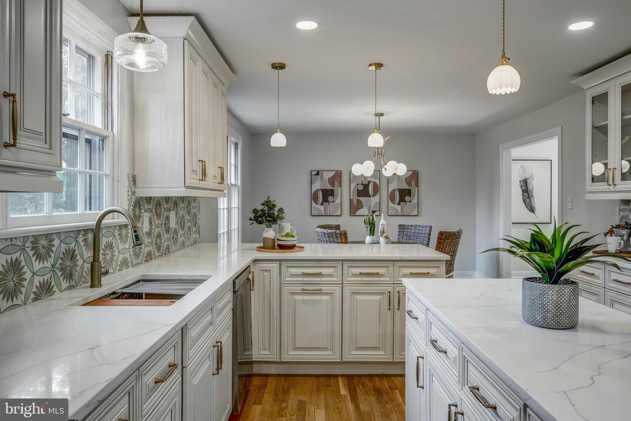 1771 Robindale Road North Chesterfield, VA 23235 - Photo 29 of 67 a kitchen with a sink a stove and cabinets