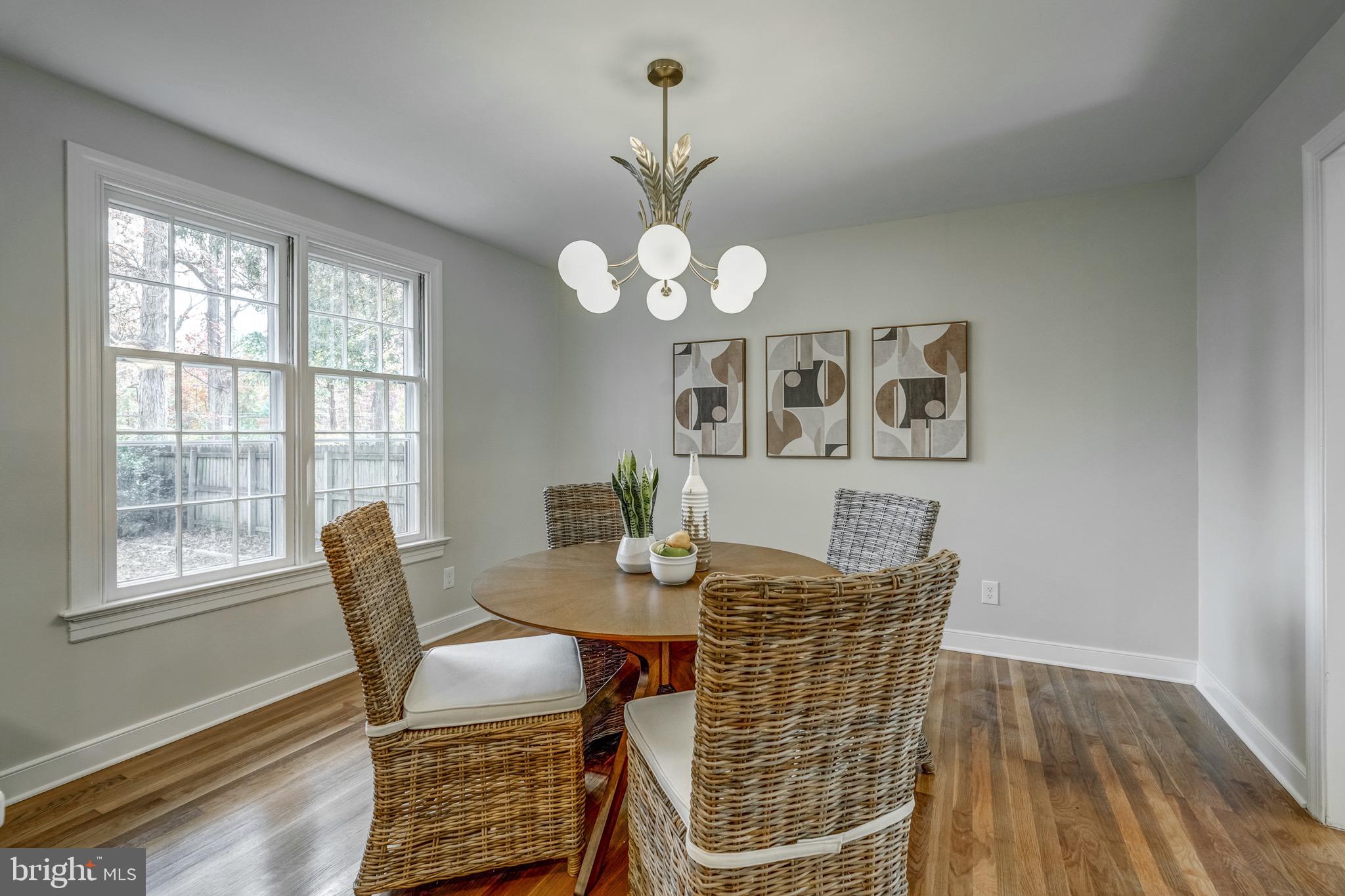 1771 Robindale Road North Chesterfield, VA 23235 - Photo 30 of 67 a view of a dining room with furniture wooden floor and chandelier