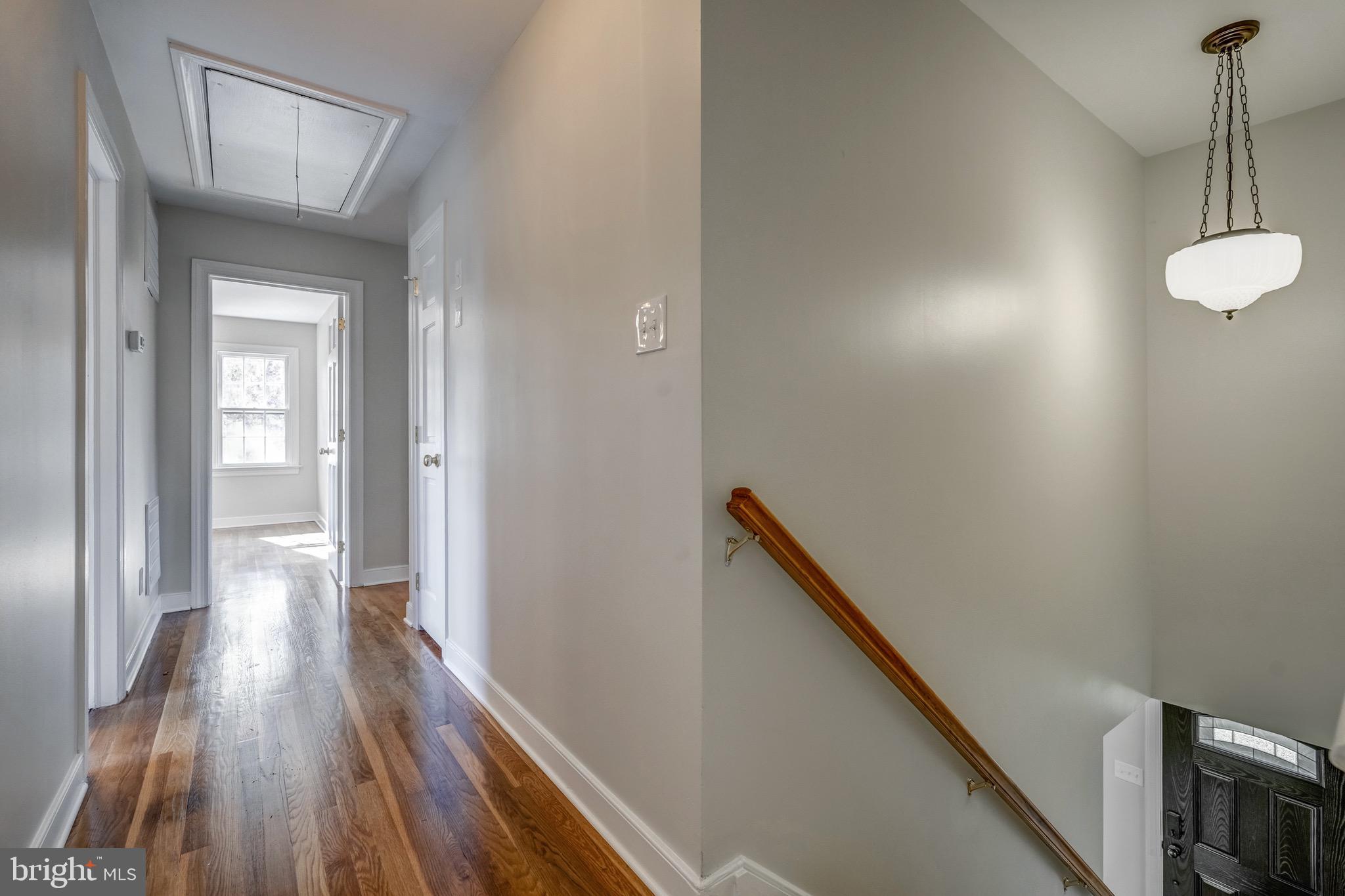 1771 Robindale Road North Chesterfield, VA 23235 - Photo 37 of 67 a view of a hallway with wooden floor and staircase