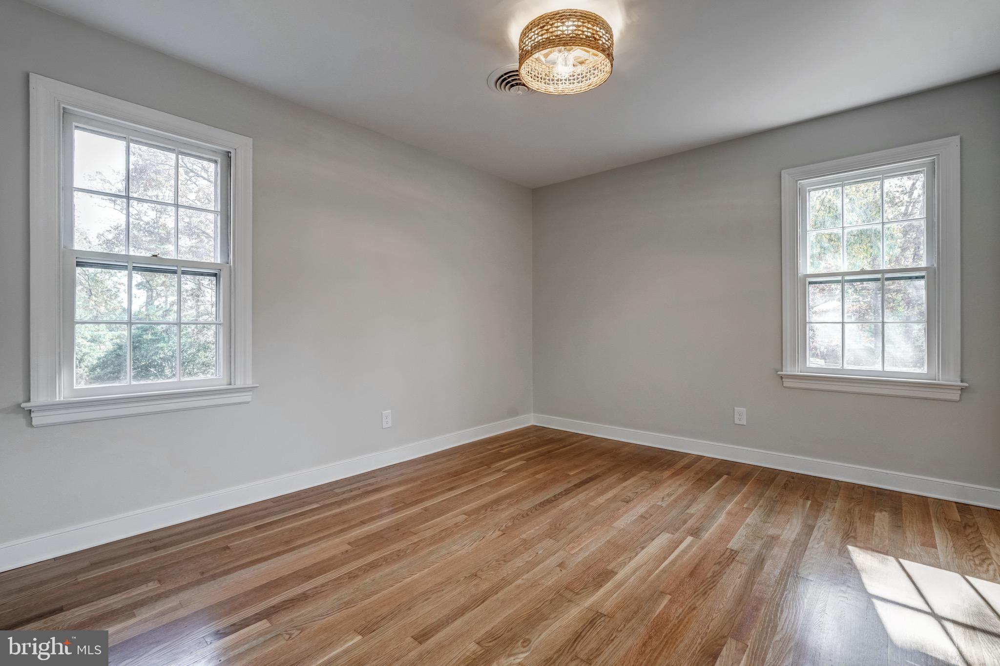1771 Robindale Road North Chesterfield, VA 23235 - Photo 48 of 67 an empty room with wooden floor and windows