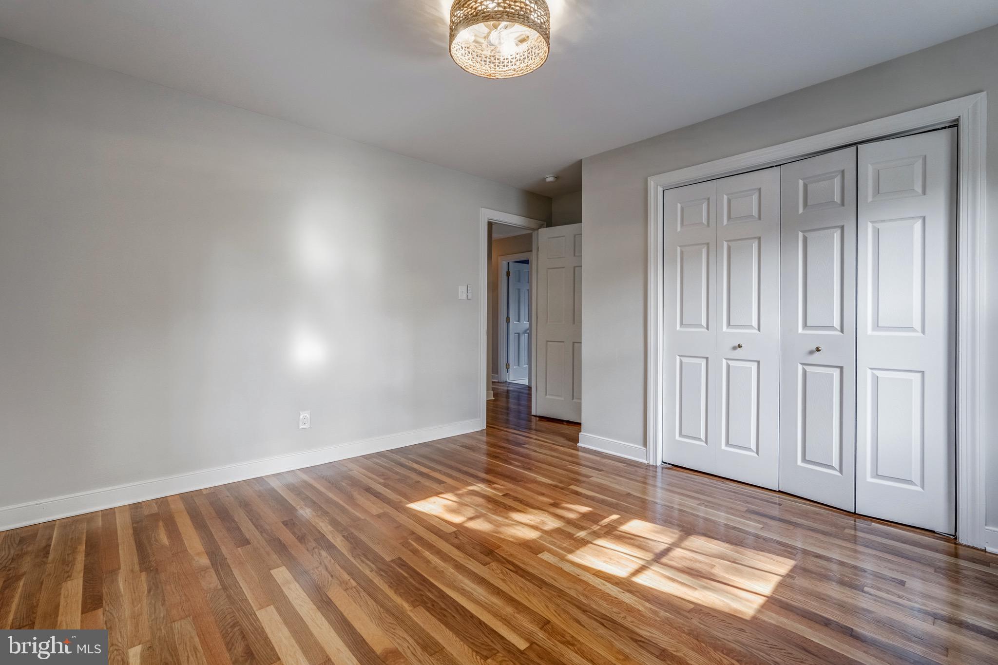 1771 Robindale Road North Chesterfield, VA 23235 - Photo 51 of 67 a view of an empty room with wooden floor and a window